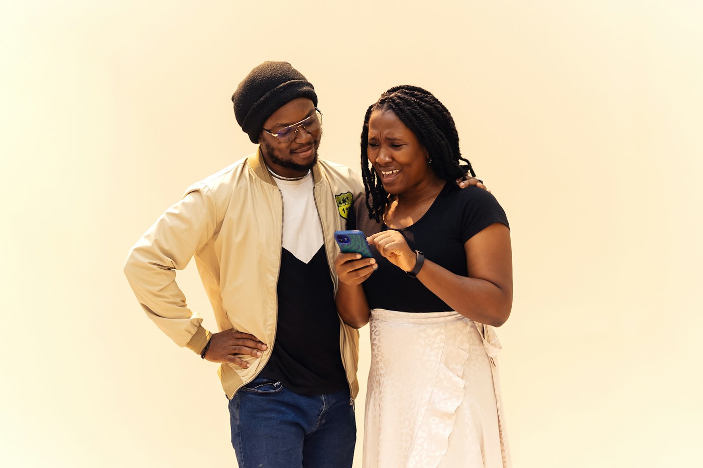 Two friends in Lagos sharing a moment over a phone